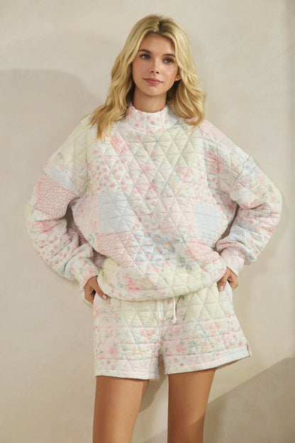 Floral textured mock neck sweater